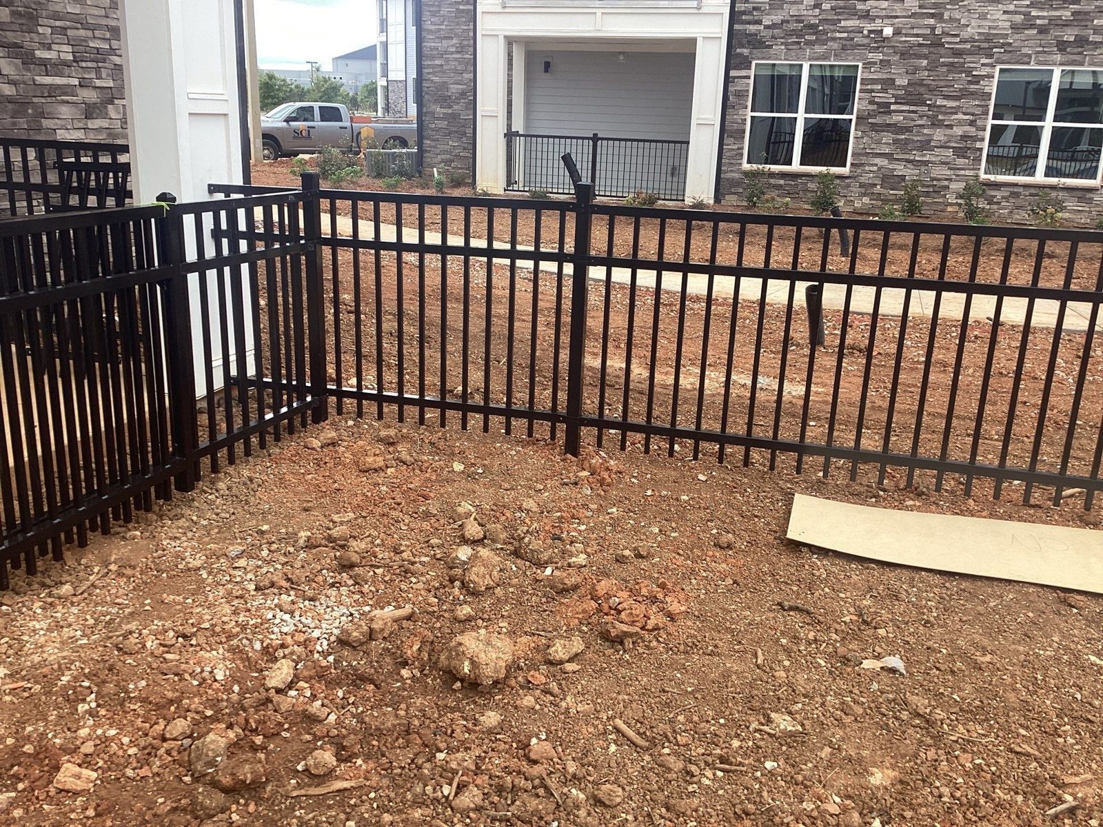 Black aluminum fence at an apartment community